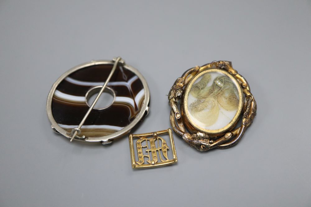 An Edwardian yellow metal, diamond and enamel set initial bracelet buckle, 17mm and two brooches